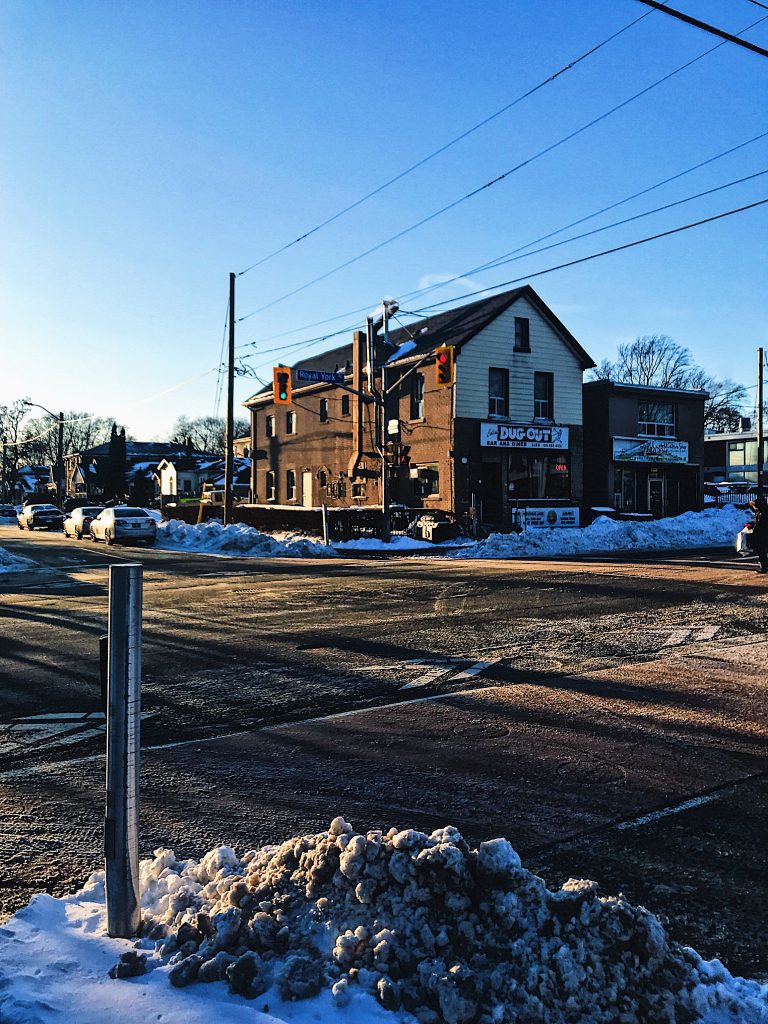 Freestanding building at corner of two streets.