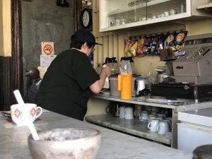 Eda whipping up her famous, thick chocolate milkshake.
