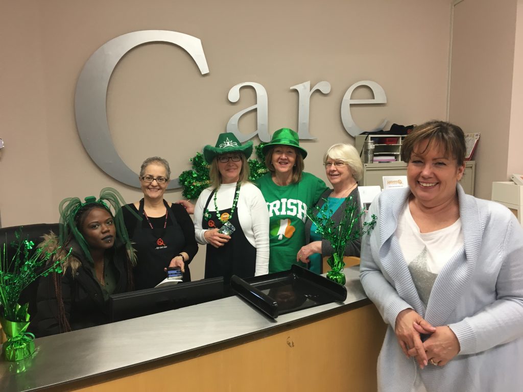 Haven staff in front of the care sign.