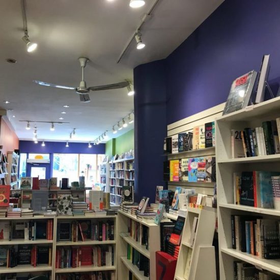 View of bookshelves from centre of the bookshop.