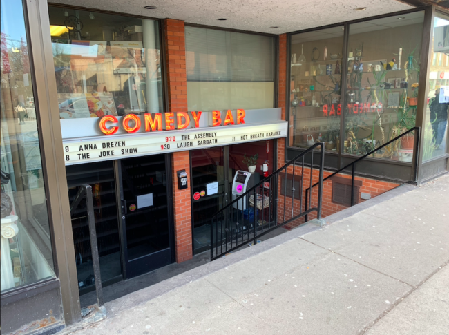 Screen Shot 2020-02-29 at 7.58.29 PM Storefront of the Comedy Bar. There are descending stairs in front.