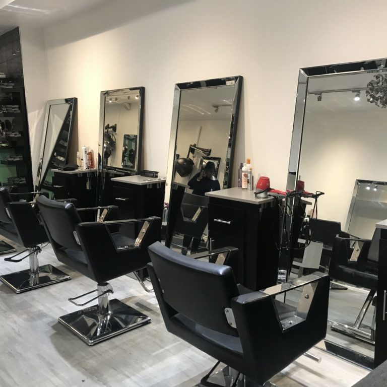 Hair salon with empty chairs.