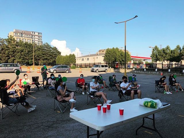 kids sitting in parking lot