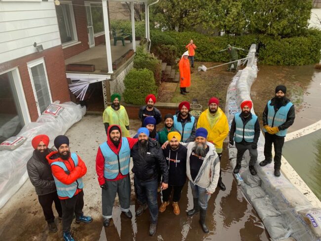 Group of people posing for a team photo.