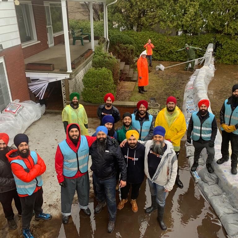 Group of people posing for a team photo.