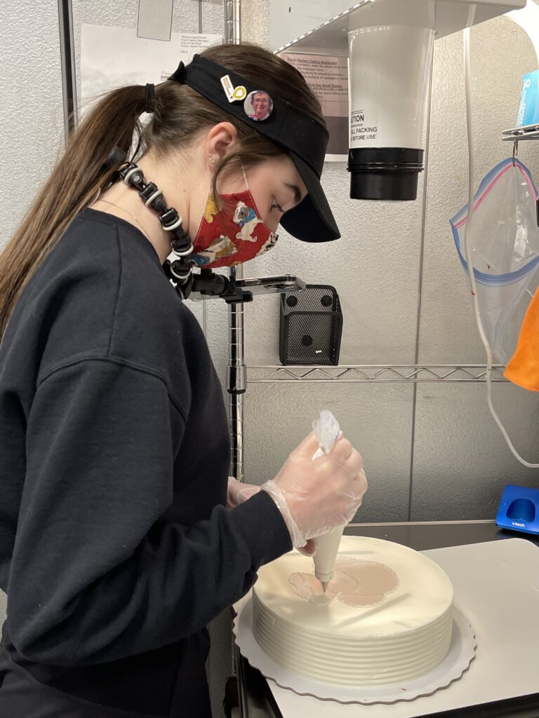 Girl decorating ice cream cake