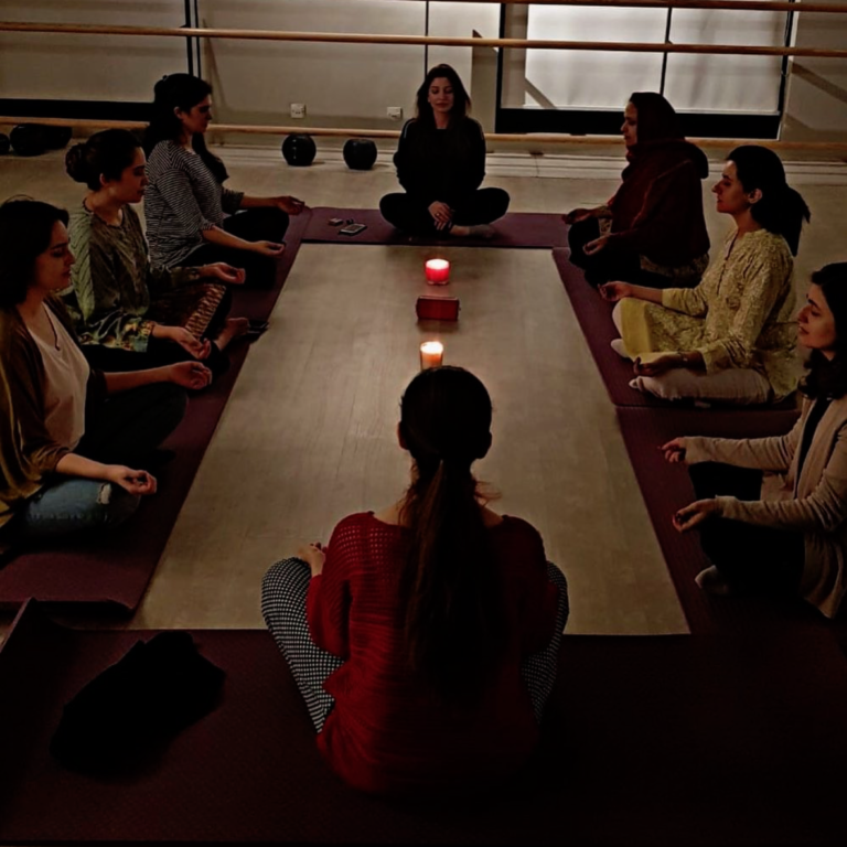 Sheikh meditating with a group of people. This is one of the new business ventures she has decided to taken and is more explained in the story.