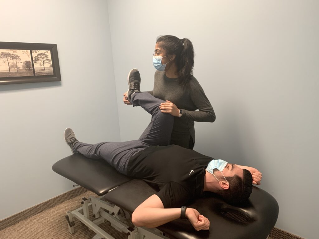 Patel is testing the range of motion to determine what is causing the patient's pain.