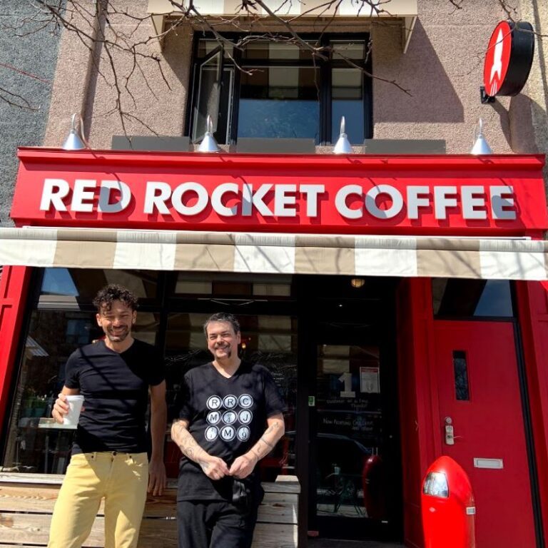Billy and Liako Dertilis laugh outside their Red Rocket Coffee shop.