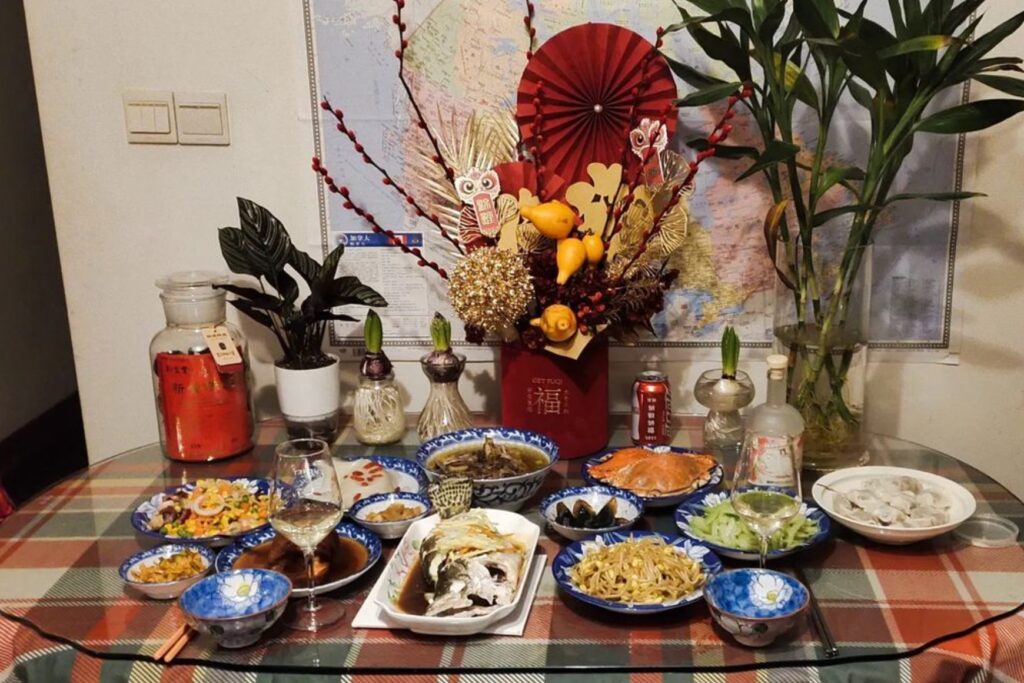 a table full of chinese dishes