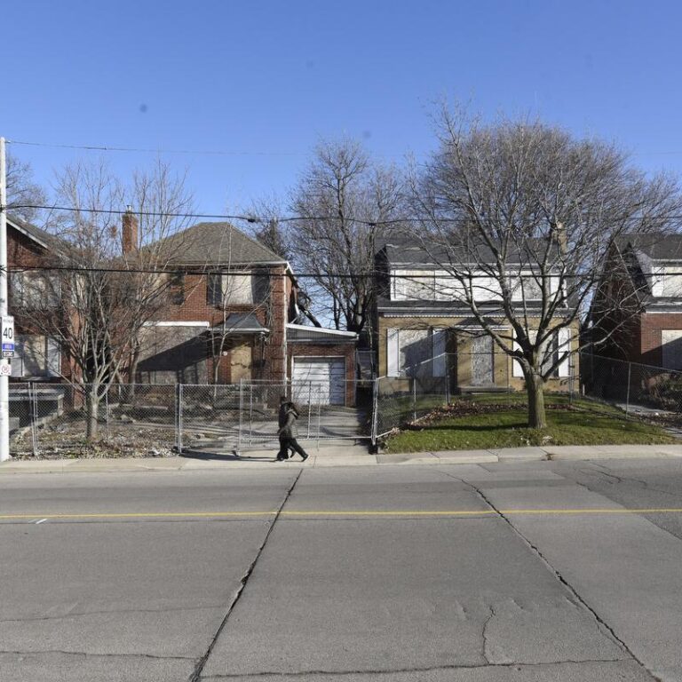 A row of houses on a residential street.