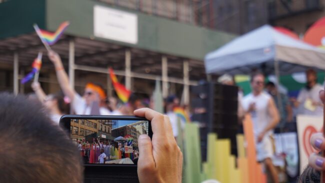 A phone camera recording a LGBTQ pride event