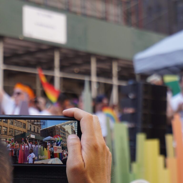 A phone camera recording a LGBTQ pride event