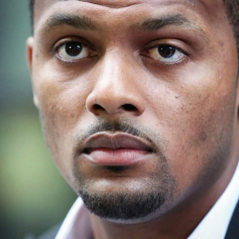 a closeup of a man looking desolately past the camera