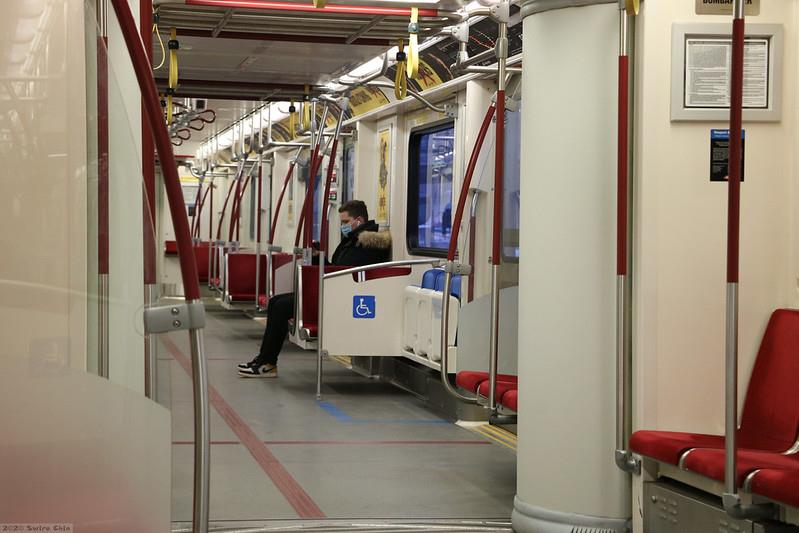 A lone rider with a mask sits in a TTC subway car in the early days of the COVID pandemic