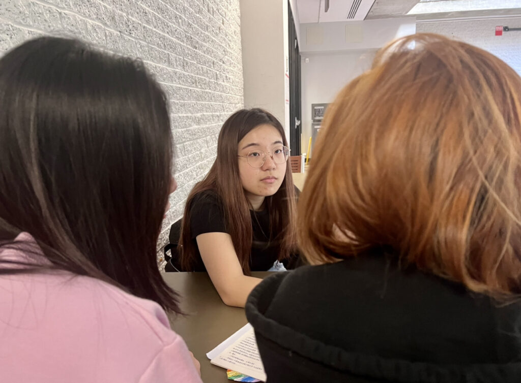 Yanti Zhou looking at her friends.