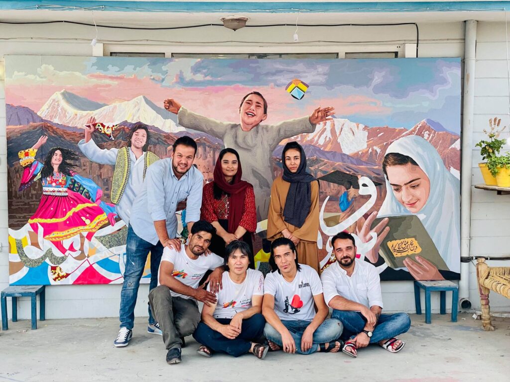 ArtLords team standing in front of their mural.