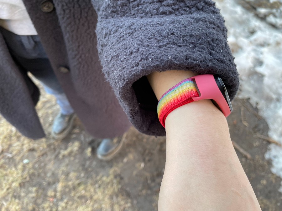 A rainbow watch band on Micah tan's wrist.
