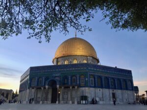 Al-Aqsa Mosque pictured during a cloudy blue sky during a sunset.  