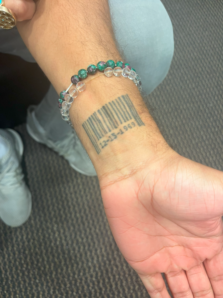 Close up of Shane Lyons barcode tattoo for his father