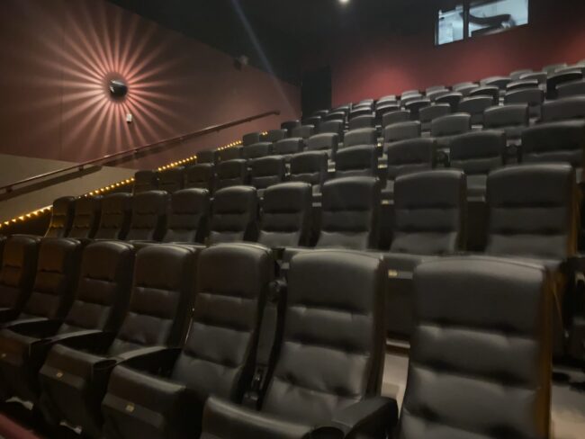 JRN_272_Feature_Photo_#2 Many rows of empty movie theatre chairs.