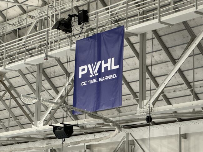 PWHL banner hanging on the rafters
